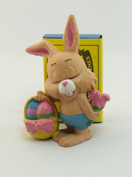 Small Bunny Rabbit Holding Easter Eggs in Basket