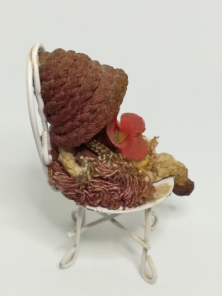 Small Wooden Brown Doll on Chair