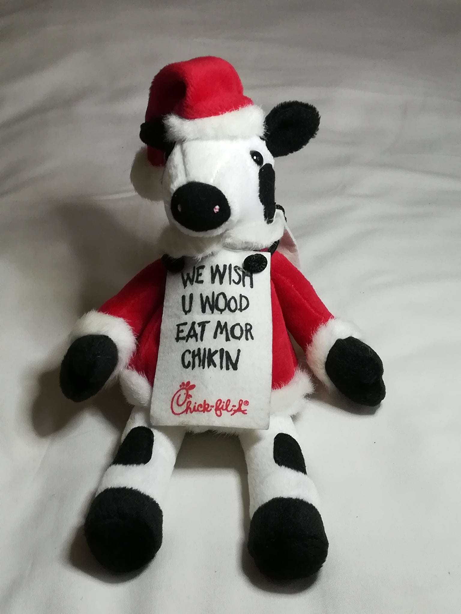 Black & White Cow Dressed in Father Christmas Suit