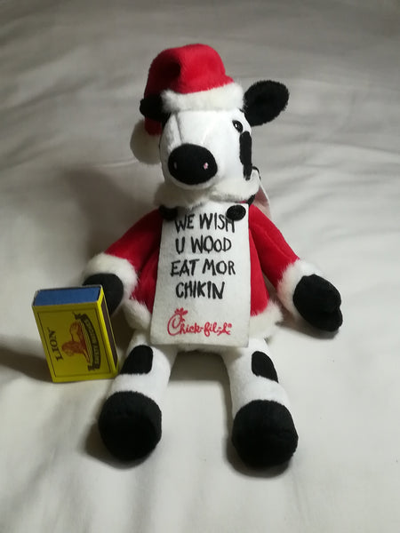 Black & White Cow Dressed in Father Christmas Suit
