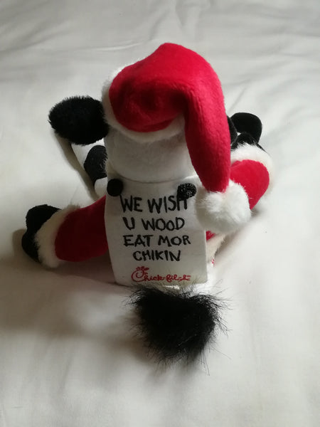 Black & White Cow Dressed in Father Christmas Suit