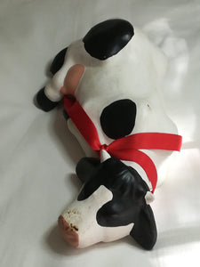 Black & White Ceramic Cow with Red Ribbon Around The Neck