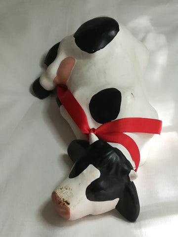 Black & White Ceramic Cow with Red Ribbon Around The Neck