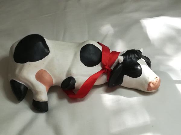 Black & White Ceramic Cow with Red Ribbon Around The Neck