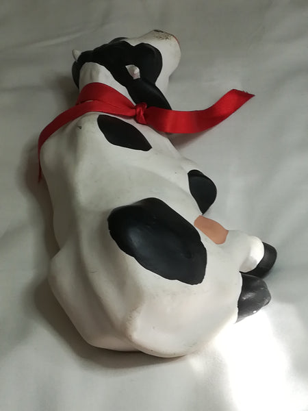 Black & White Ceramic Cow with Red Ribbon Around The Neck